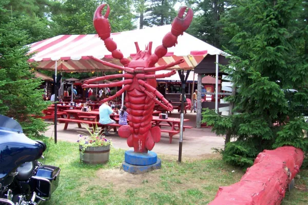 A giant red statue of a lobster.