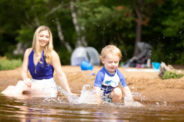A family swimming in Lake Clear.