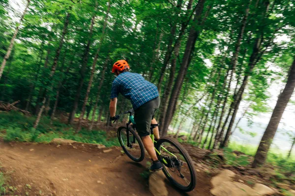 A mountain biker hits a berm