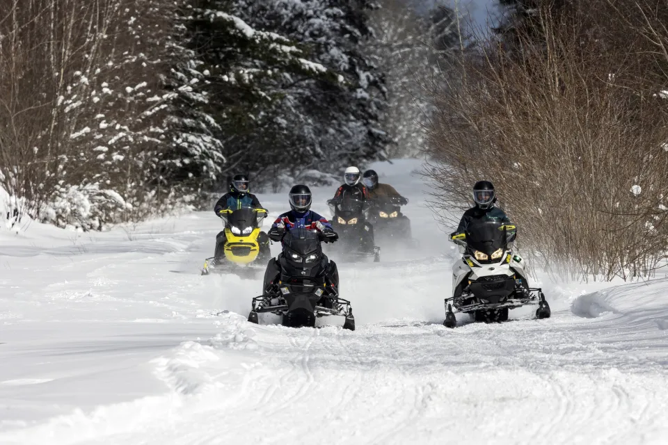 A group of snowmobilers on the Rail Trail.