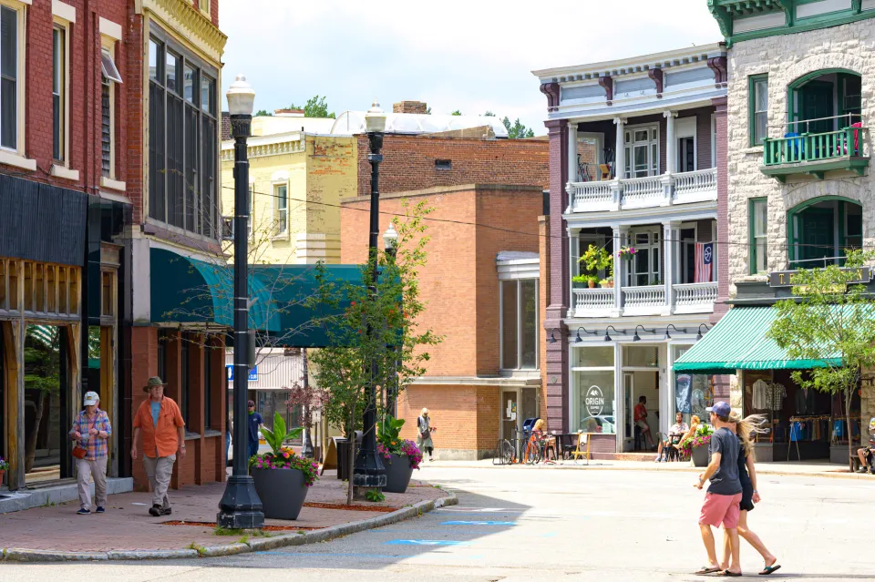 Peopl walk in a downtown of a small town.